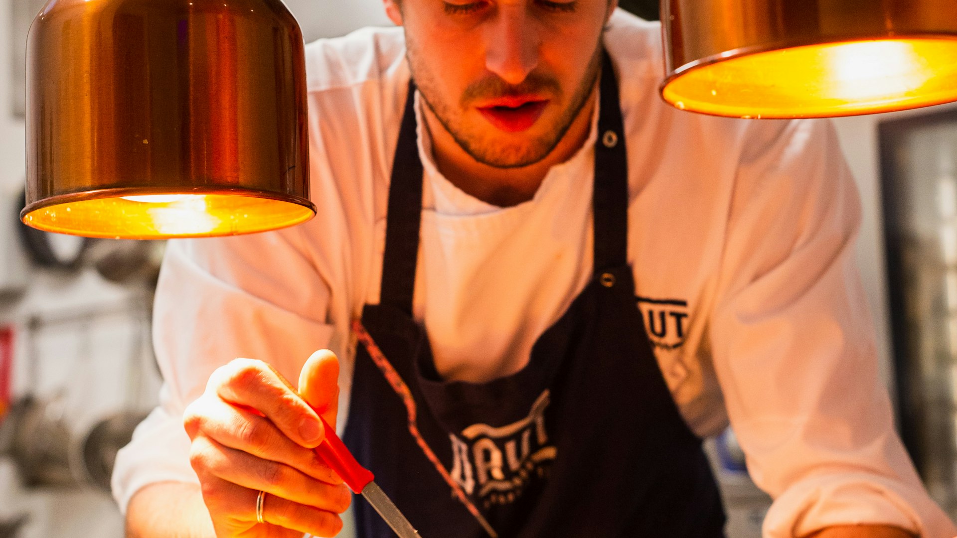 A chef plating a dish